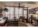 Bright sunroom with comfy chair and workspace at 2240 Stickney Point Rd # 213, Sarasota, FL 34231