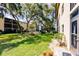 Community patio area with seating and lush landscaping at 2240 Stickney Point Rd # 213, Sarasota, FL 34231