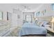 Comfortable bedroom with coastal decor, light wood furniture, and serene, calming colors at 232 Benedetto Ct, Nokomis, FL 34275