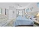 Comfortable bedroom with coastal decor, light wood furniture, and serene, calming colors at 232 Benedetto Ct, Nokomis, FL 34275