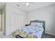 Neutral bedroom with a double bed and a closet with bi-fold doors at 232 Benedetto Ct, Nokomis, FL 34275