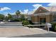 Gated entrance to community with security gate and paved road at 3000 Ibis Way # 102, Venice, FL 34292