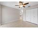 Light and airy bedroom with tiled floors and double door closet at 324 Wexford Ter # 171, Venice, FL 34293