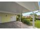 Private carport with adjacent storage and landscaping at 324 Wexford Ter # 171, Venice, FL 34293