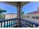 Enjoy scenic views of the community pool and surrounding buildings from this private balcony at 3730 Cadbury Cir # 400, Venice, FL 34293