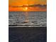 Stunning sunset over the ocean with beach in foreground at 3730 Cadbury Cir # 400, Venice, FL 34293