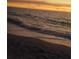 Waves gently lapping on the beach at sunset at 3730 Cadbury Cir # 400, Venice, FL 34293