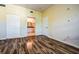 Bedroom with wood floors and access to a full bathroom at 3730 Cadbury Cir # 400, Venice, FL 34293
