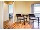 Cozy dining area with wicker chairs and access to a balcony at 3730 Cadbury Cir # 400, Venice, FL 34293