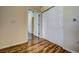 Spacious hallway with wood flooring and neutral walls at 3730 Cadbury Cir # 400, Venice, FL 34293