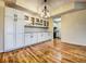 Modern white kitchen with granite counters and ample cabinetry at 3730 Cadbury Cir # 400, Venice, FL 34293