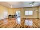 Living room with hardwood floors, access to balcony and kitchen at 3730 Cadbury Cir # 400, Venice, FL 34293