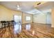 Living room with hardwood floors, access to balcony, and dining area at 3730 Cadbury Cir # 400, Venice, FL 34293