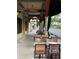 Outdoor cafe seating with ceiling fans and street view at 3730 Cadbury Cir # 400, Venice, FL 34293