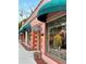 Three storefronts with teal awnings and brick sidewalks at 3730 Cadbury Cir # 400, Venice, FL 34293
