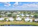 Aerial view of houses and community near a lake at 452 Wexford Cir # 105, Venice, FL 34293