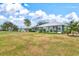Community backyard view with multiple homes at 452 Wexford Cir # 105, Venice, FL 34293