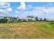 Community backyard view with multiple homes at 452 Wexford Cir # 105, Venice, FL 34293
