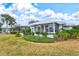 Backyard view showcasing home and landscaping at 452 Wexford Cir # 105, Venice, FL 34293