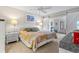 Main bedroom with king-size bed, barn doors and dresser at 452 Wexford Cir # 105, Venice, FL 34293