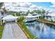 Charming covered bridge leads to the community clubhouse at 452 Wexford Cir # 105, Venice, FL 34293