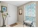 Bright entryway with tiled floor, stained glass window, and bench at 452 Wexford Cir # 105, Venice, FL 34293
