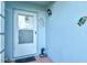 White front door with glass panel and decorative accents at 452 Wexford Cir # 105, Venice, FL 34293