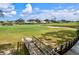 Golf course view with bridge and water feature at 452 Wexford Cir # 105, Venice, FL 34293