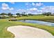 Golf course sand trap and water feature at 452 Wexford Cir # 105, Venice, FL 34293