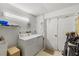 Laundry room with washer, dryer, and storage at 452 Wexford Cir # 105, Venice, FL 34293
