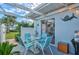 Outdoor patio with string lights, seating area and grill at 452 Wexford Cir # 105, Venice, FL 34293