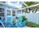 Relaxing patio features string lights and seating for four at 452 Wexford Cir # 105, Venice, FL 34293
