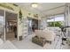 Relaxing sunroom with access to the backyard and comfortable seating at 452 Wexford Cir # 105, Venice, FL 34293