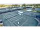 Community tennis courts offer a great place to enjoy a game at 452 Wexford Cir # 105, Venice, FL 34293