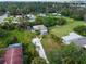 Aerial view showing a charming blue house with a large grassy yard at 4533 Church St, Punta Gorda, FL 33980