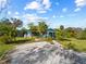Charming blue house with a spacious yard and carport at 4533 Church St, Punta Gorda, FL 33980