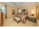 Cozy bedroom featuring soft lighting and a stylish upholstered bed at 457 Anchorage Dr, Nokomis, FL 34275