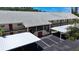 Condo building with parking and covered walkways at 509 Parkdale Mews # 509, Venice, FL 34285