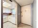 Condo kitchen with white cabinets and appliances at 509 Parkdale Mews # 509, Venice, FL 34285