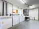 Shared laundry room with several washers and dryers at 509 Parkdale Mews # 509, Venice, FL 34285