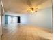 Living room with access to balcony and tile floors at 509 Parkdale Mews # 509, Venice, FL 34285
