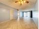 Living room with tile floors and access to patio at 509 Parkdale Mews # 509, Venice, FL 34285