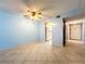Living area with tile floors and kitchen access at 509 Parkdale Mews # 509, Venice, FL 34285