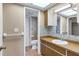 Bathroom with wood vanity and tile flooring at 5221 Lemon Bay Dr, Venice, FL 34293