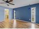 Spacious bedroom with blue walls and wood-look flooring at 5221 Lemon Bay Dr, Venice, FL 34293
