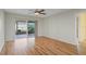 Hardwood floor bedroom with sliding glass doors to patio at 5221 Lemon Bay Dr, Venice, FL 34293
