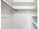 Spacious closet with shelves and hanging rod at 5221 Lemon Bay Dr, Venice, FL 34293