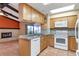 Kitchen boasts granite countertops, wood cabinets, and tile floors at 5221 Lemon Bay Dr, Venice, FL 34293