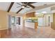 Open concept kitchen with granite counters and breakfast bar at 5221 Lemon Bay Dr, Venice, FL 34293