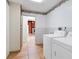Laundry room with washer, dryer, and storage at 5221 Lemon Bay Dr, Venice, FL 34293